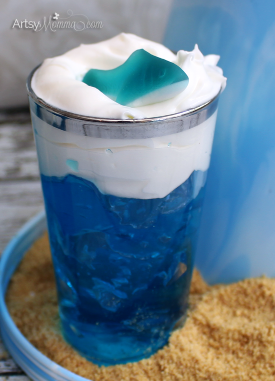 Blue Jello with whipped cream and Shark Gummies