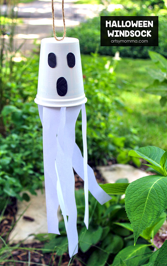 Turn empty plastic snack cups into kid-made Halloween decorations! One cute idea is to make a recycled snack cup ghost windsock craft.