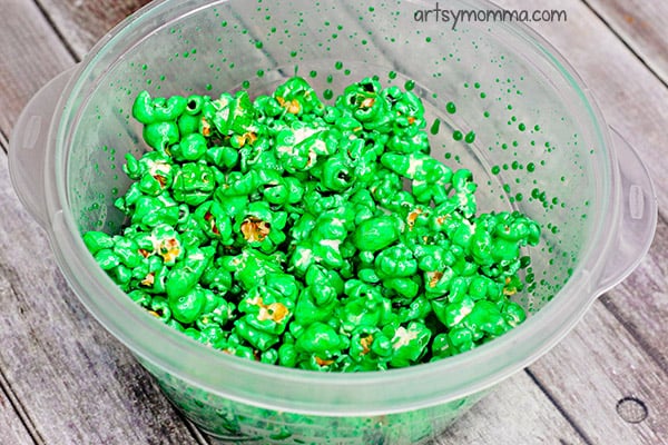 Colored Popcorn Tutorial For Party Snacks - Mix in food coloring.