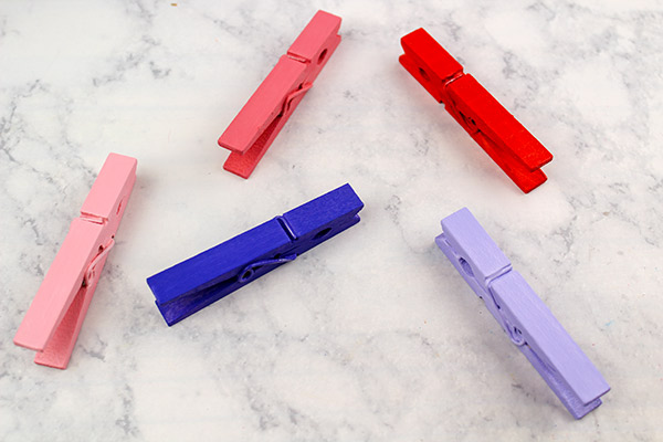 Paint clothespins in Valentine's colors