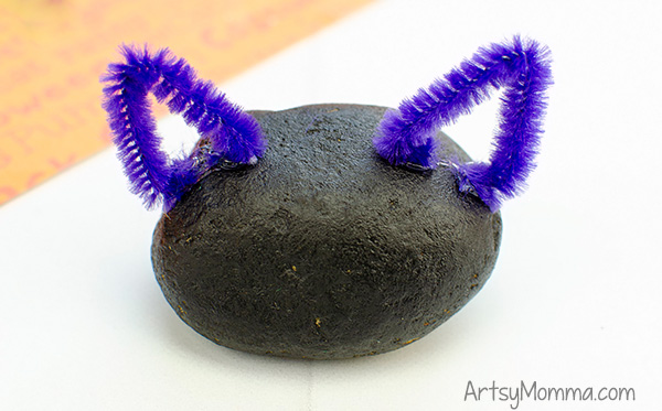 Painted Rock Black Cat Craft with triangle shaped pipe cleaner ears