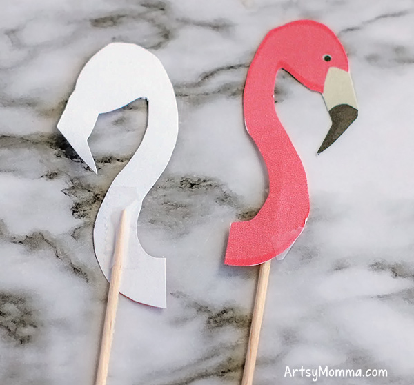 Printed Flamingo Heads Taped to Toothpicks