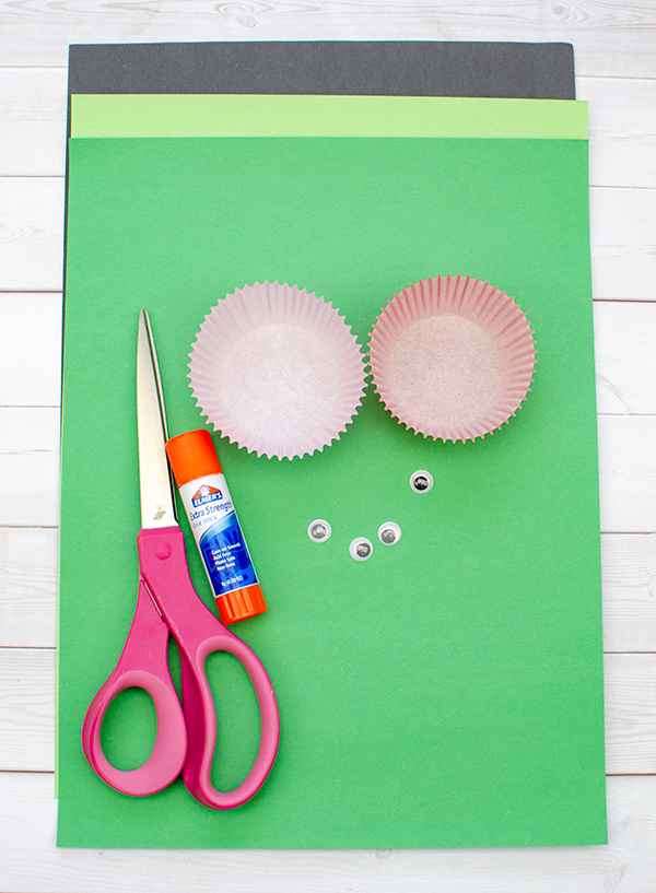 black & green construction paper, cupcake liners and googly eyes