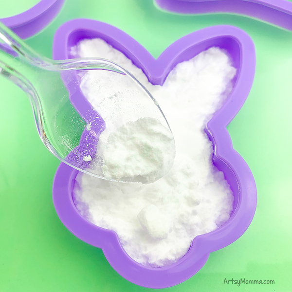 baking soda spooned into bunny cookie cutter